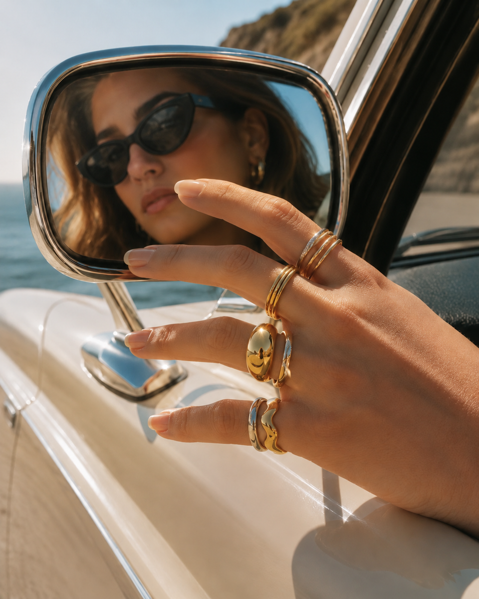 Hand wearing a delicate Valesstra pavé ring beside a coffee cup.